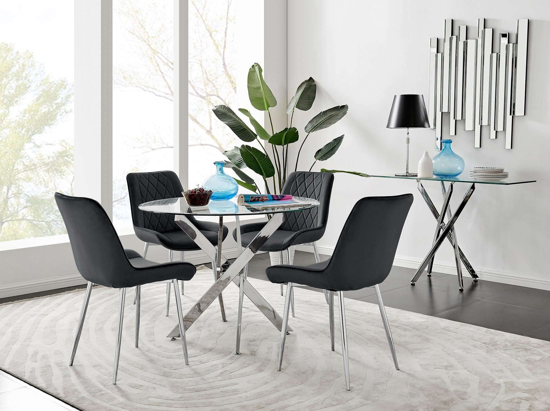FurnitureboxUK Novara Clear Tempered Glass 100cm Round Dining Table with Chrome Starburst Legs & 4 Pesaro Velvet Silver Leg Chairs in Black