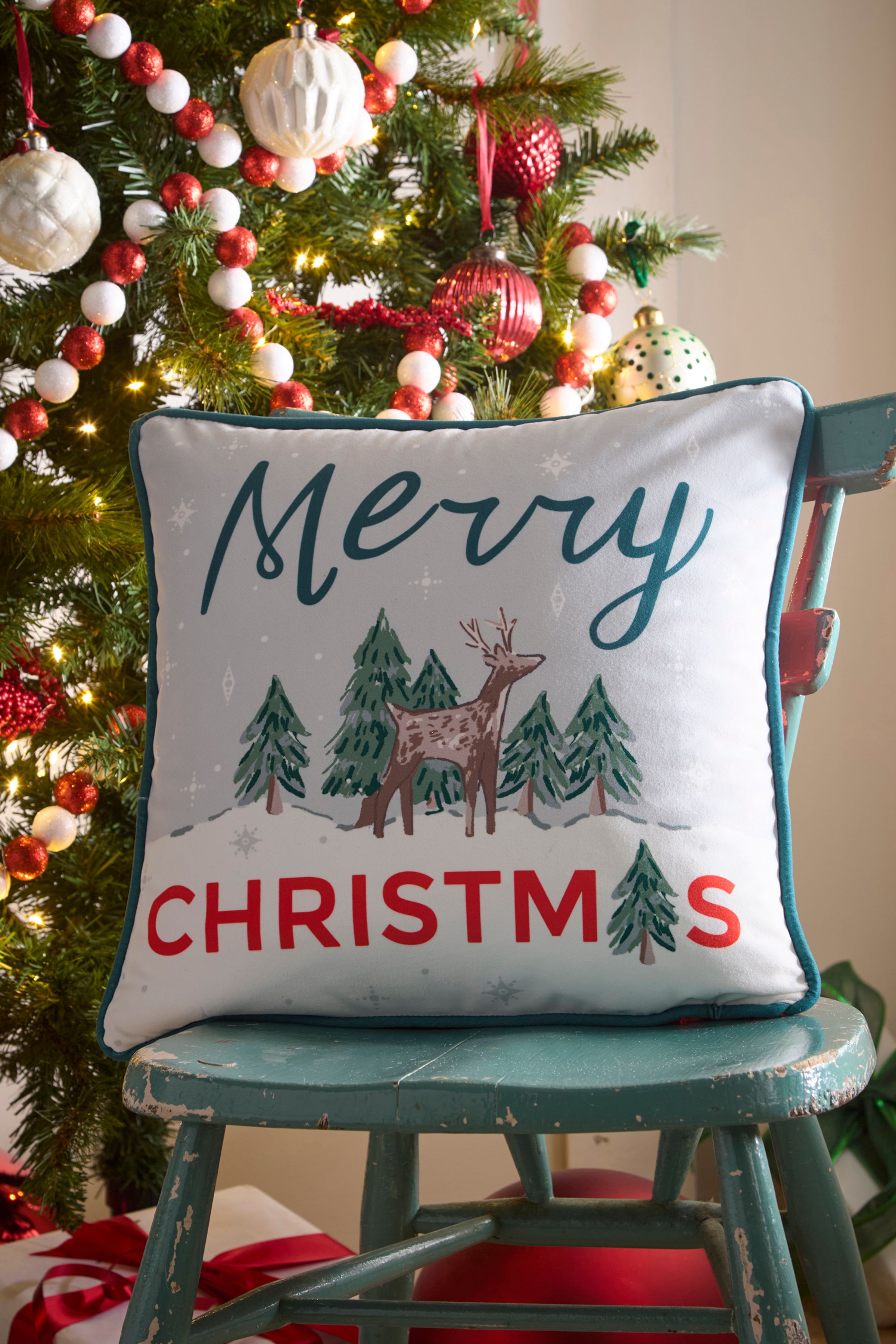 Fusion 'Merry Christmas Deer' Festive Print Velvet Filled Cushion in Green