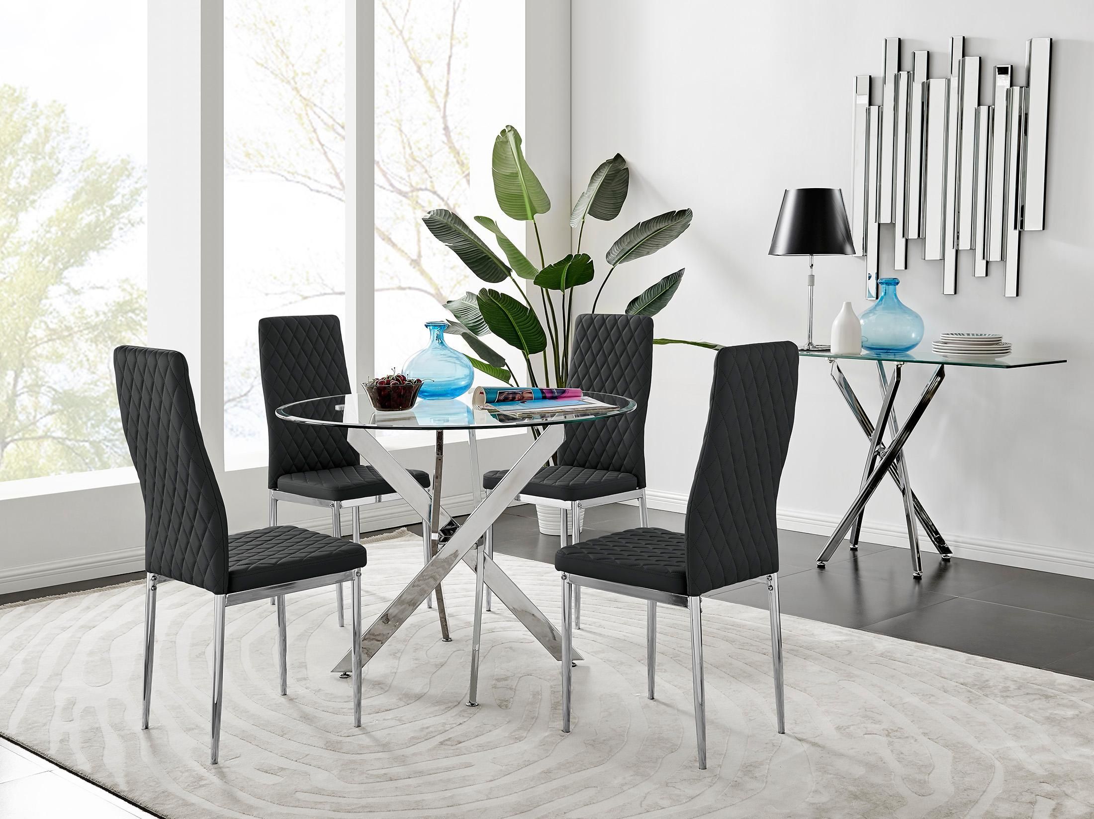FurnitureboxUK Novara Clear Tempered Glass 100cm Round Dining Table with Chrome Starburst Legs & 4 Milan Faux Leather Chairs in Black