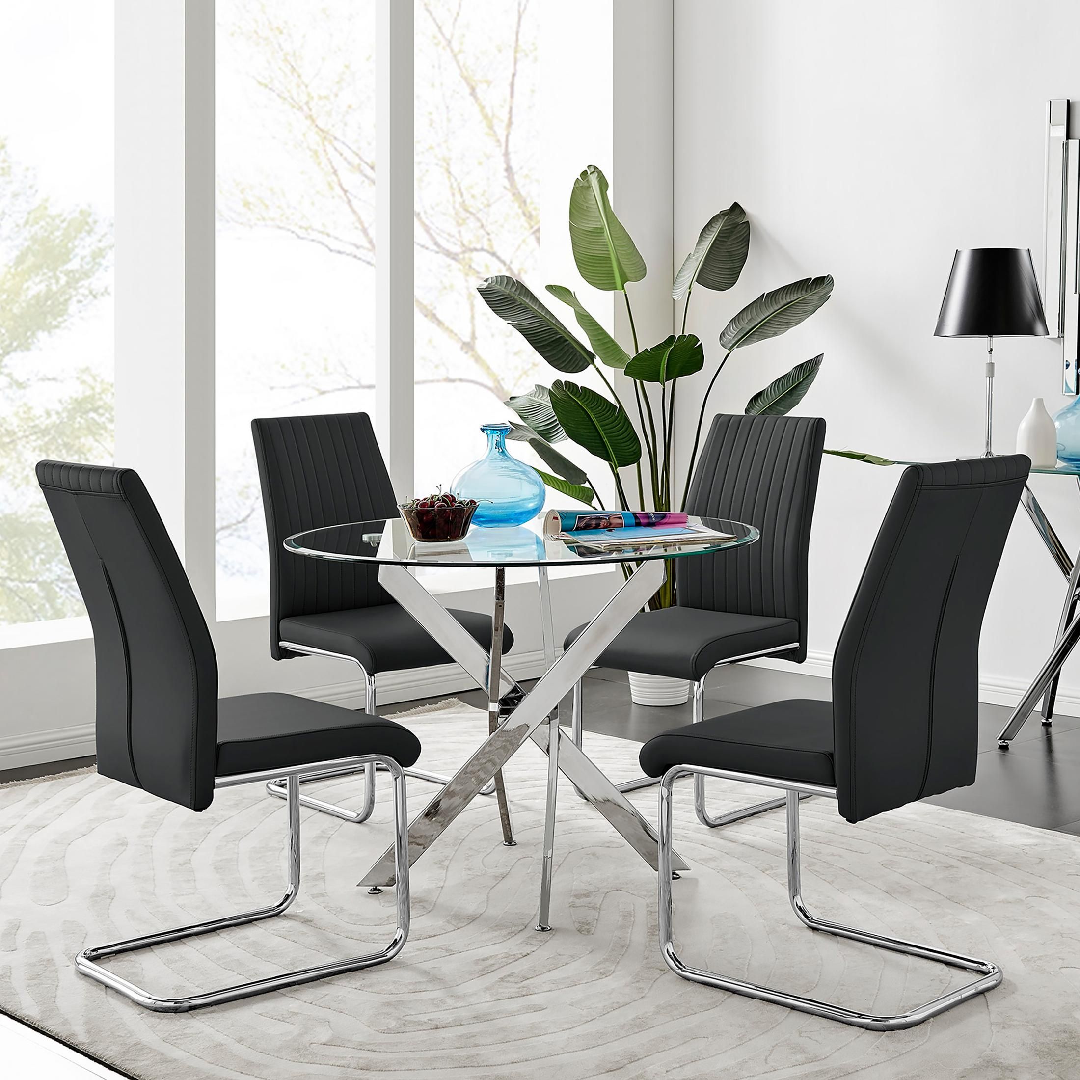 FurnitureboxUK Novara Clear Tempered Glass 100cm Round Dining Table with Chrome Starburst Legs & 4 Lorenzo Faux Leather Chairs in Black