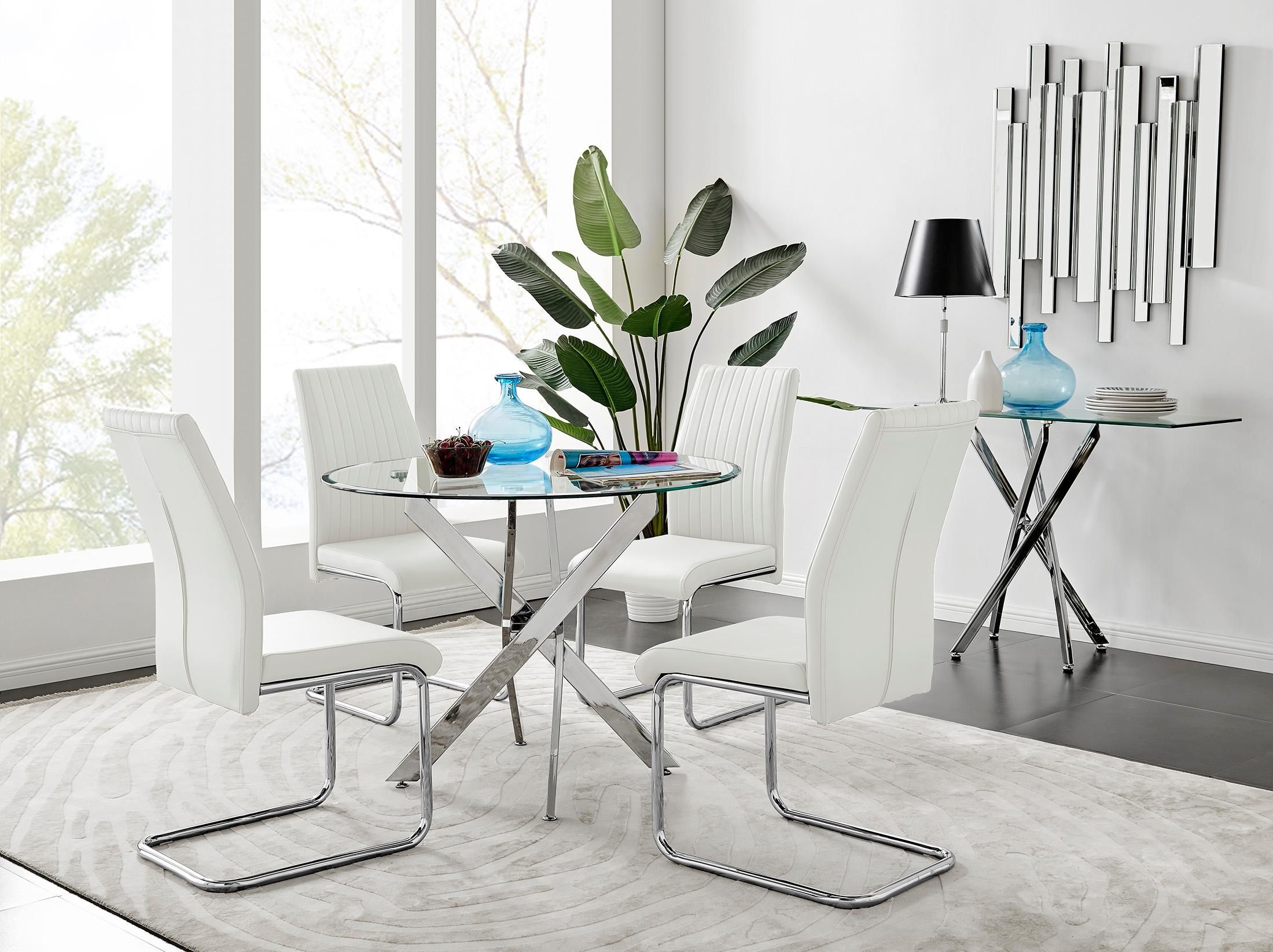 FurnitureboxUK Novara Clear Tempered Glass 100cm Round Dining Table with Chrome Starburst Legs & 4 Lorenzo Faux Leather Chairs in White