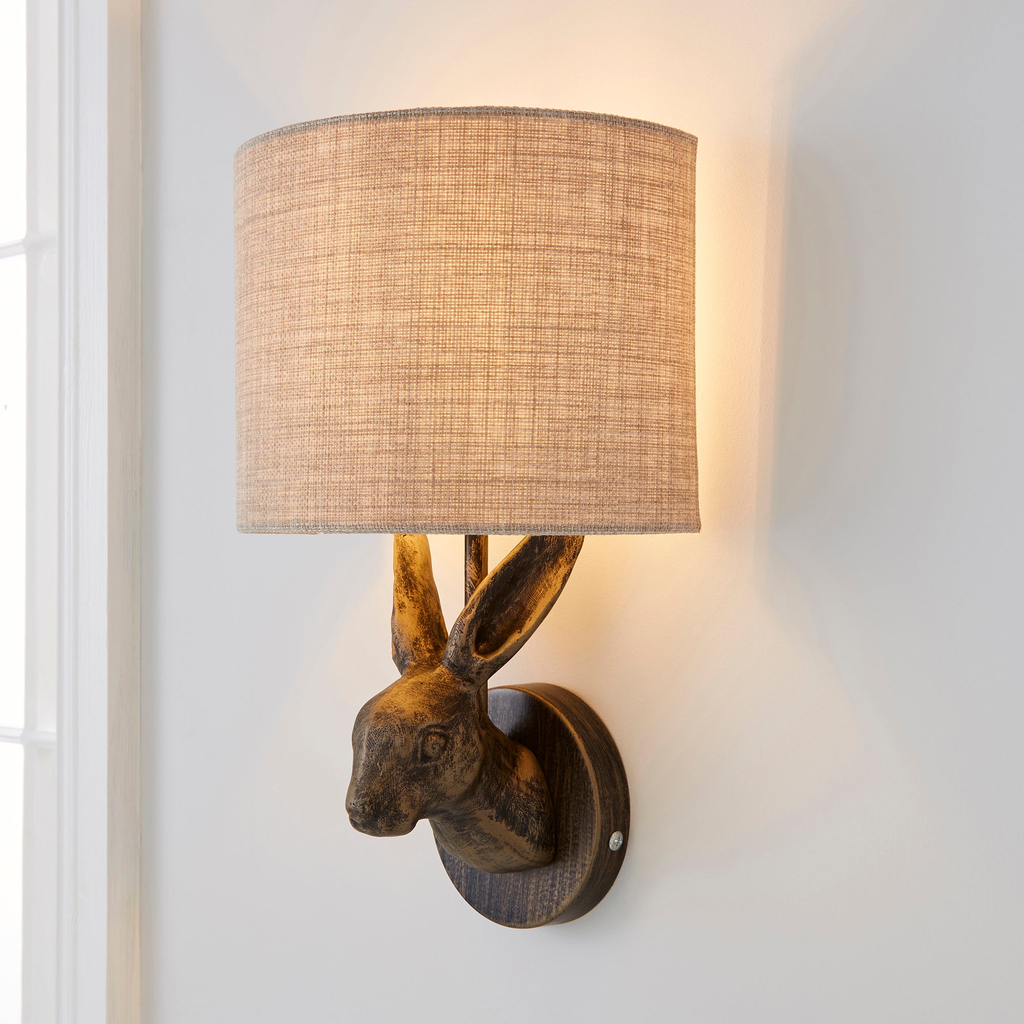 Hare Bronze Wall Light Brass