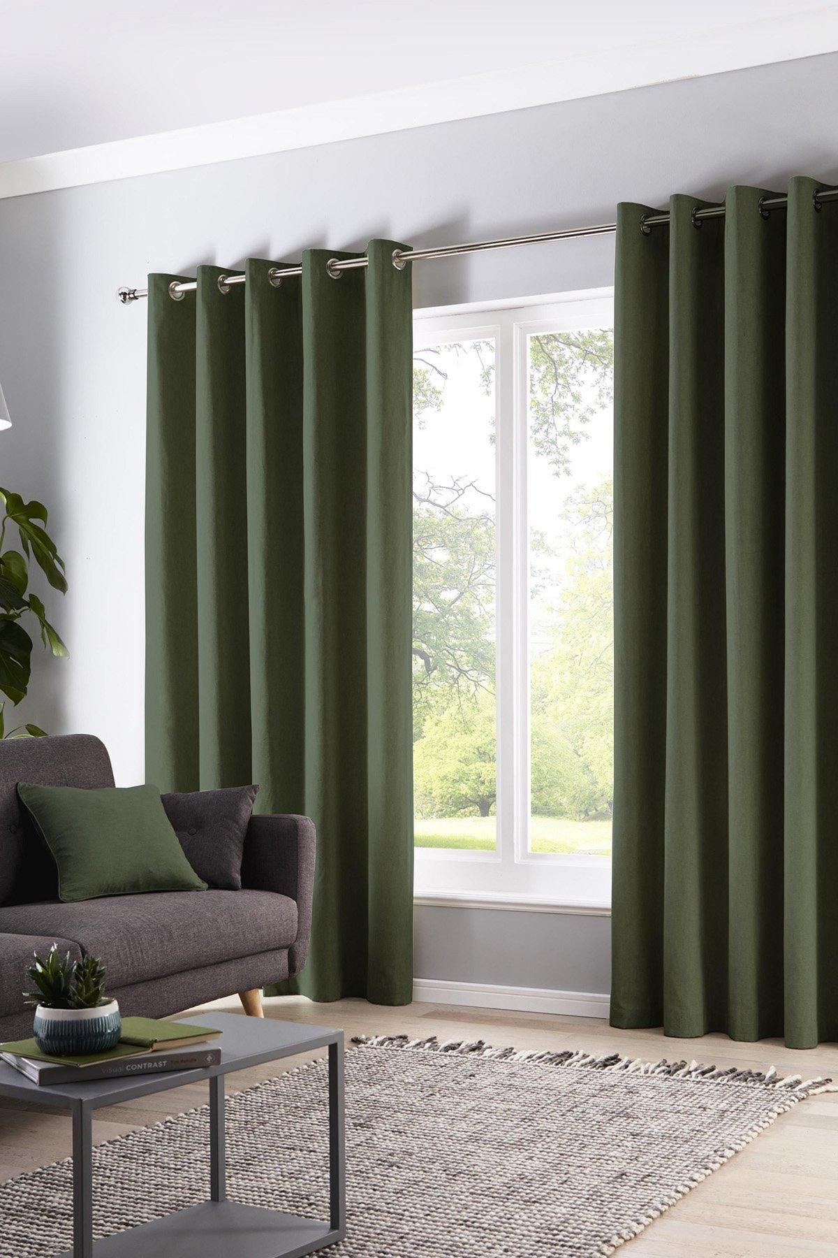 Fusion 'Sorbonne' 100% Cotton Light Filtering Plain Dyed Eyelet Curtains in Bottle Green