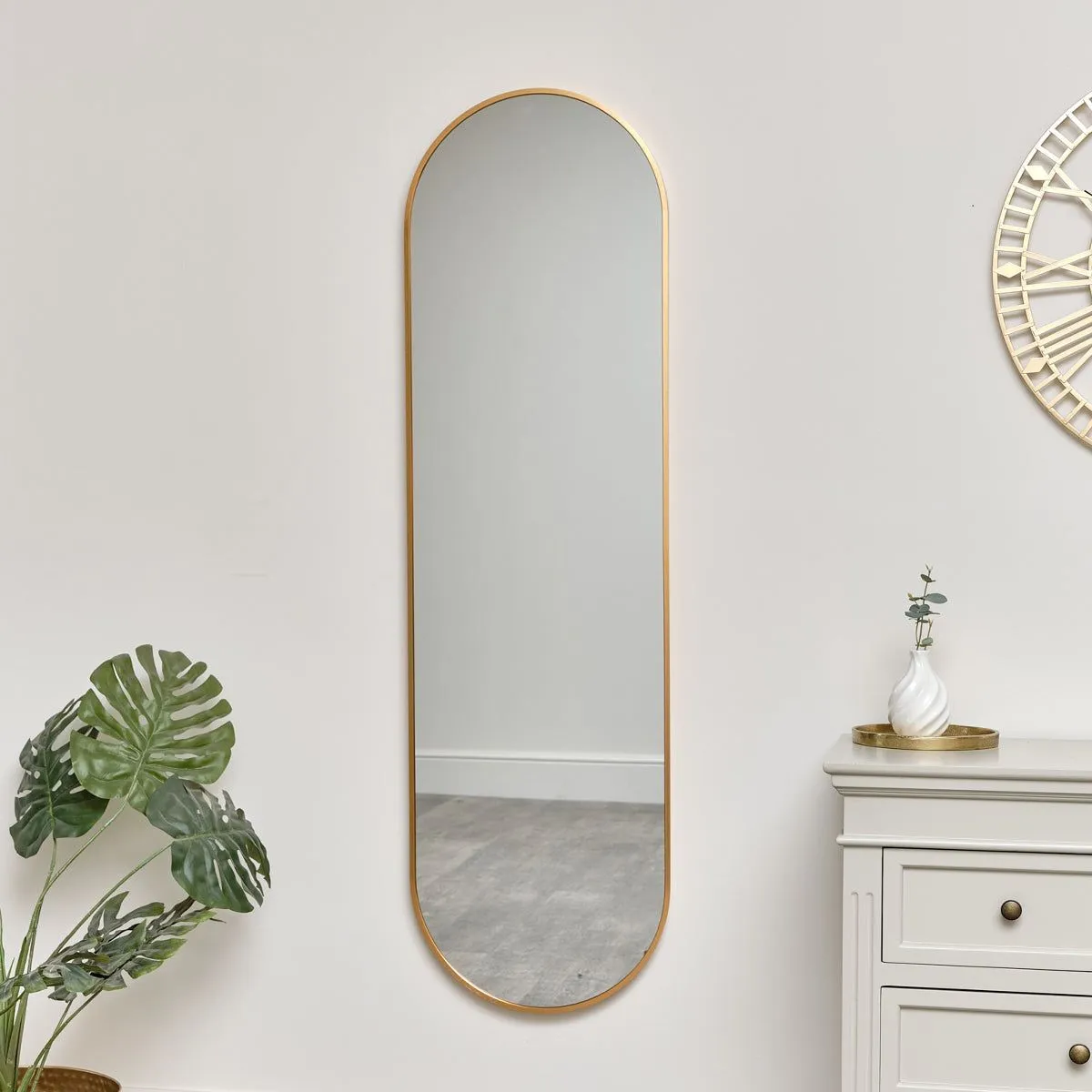 Melody Maison Warm Gold Oval Framed Wall Mirror 140cm X 40cm in Metallic Gold