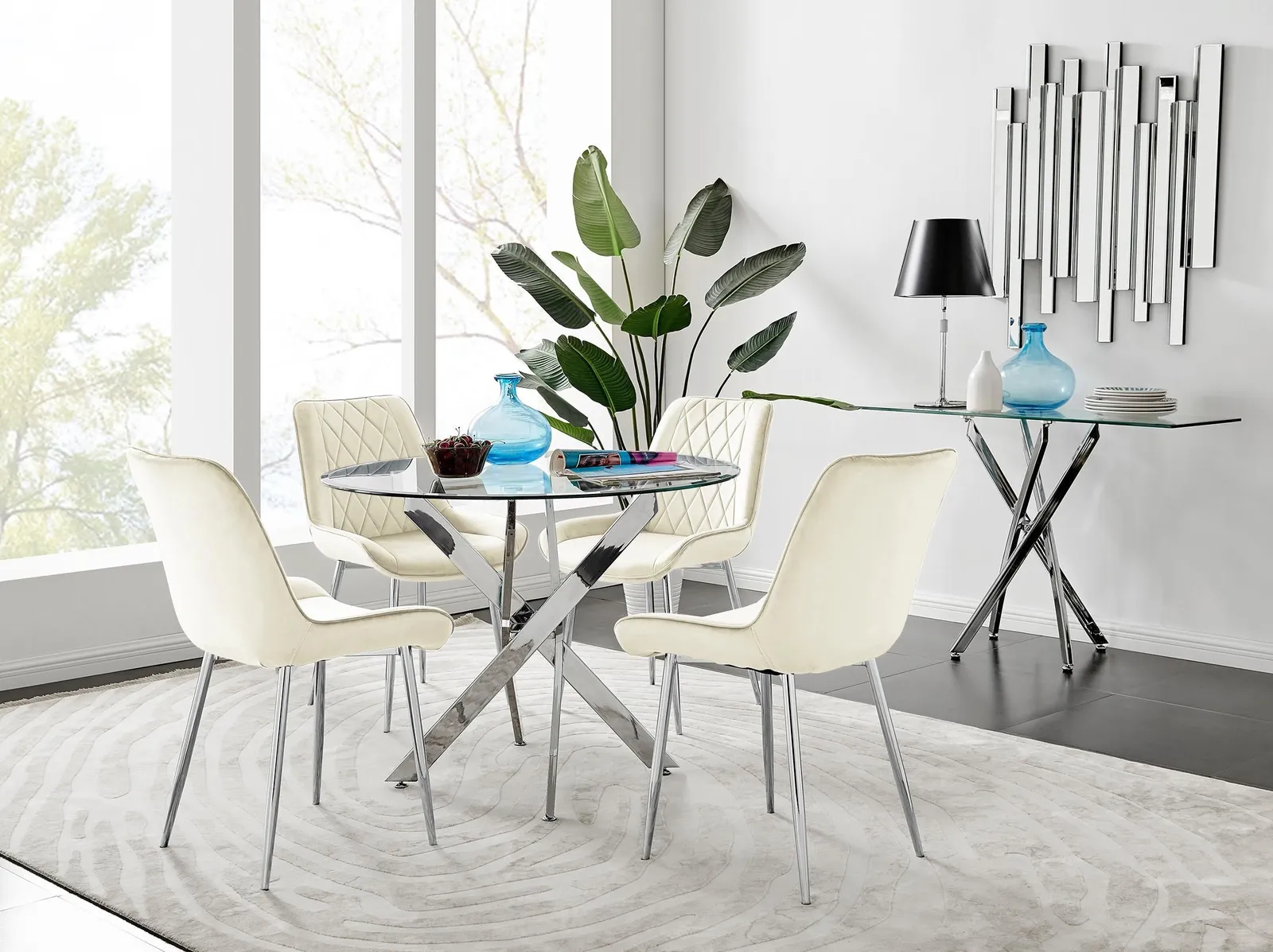 FurnitureboxUK Novara Clear Tempered Glass 100cm Round Dining Table with Chrome Starburst Legs & 4 Pesaro Velvet Silver Leg Chairs in Cream 1