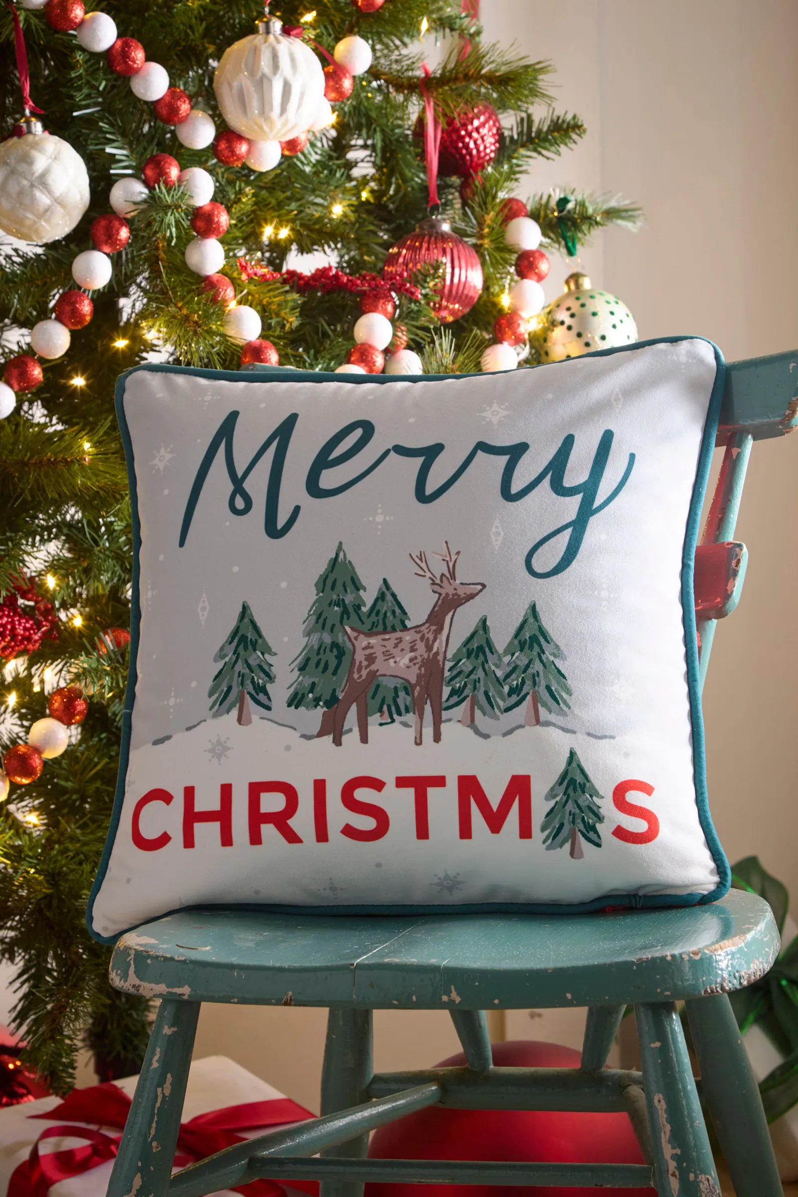 Fusion 'Merry Christmas Deer' Festive Print Velvet Filled Cushion in Green