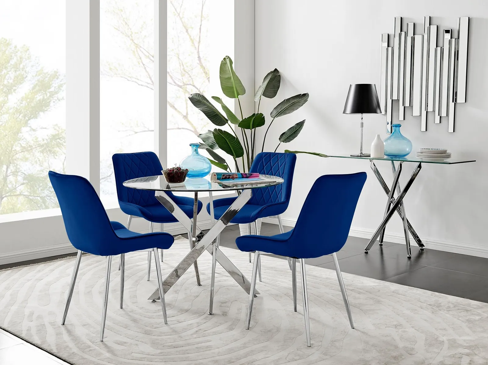 FurnitureboxUK Novara Clear Tempered Glass 100cm Round Dining Table with Chrome Starburst Legs & 4 Pesaro Velvet Silver Leg Chairs in White 1