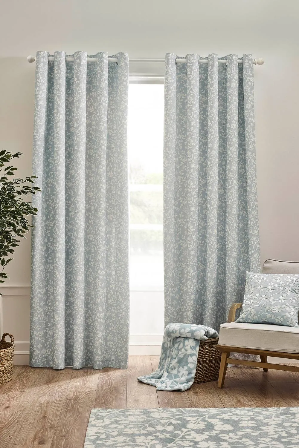 Catherine Lansfield 'Brooke Floral' Lined Eyelet Curtains in Duck Egg Blue