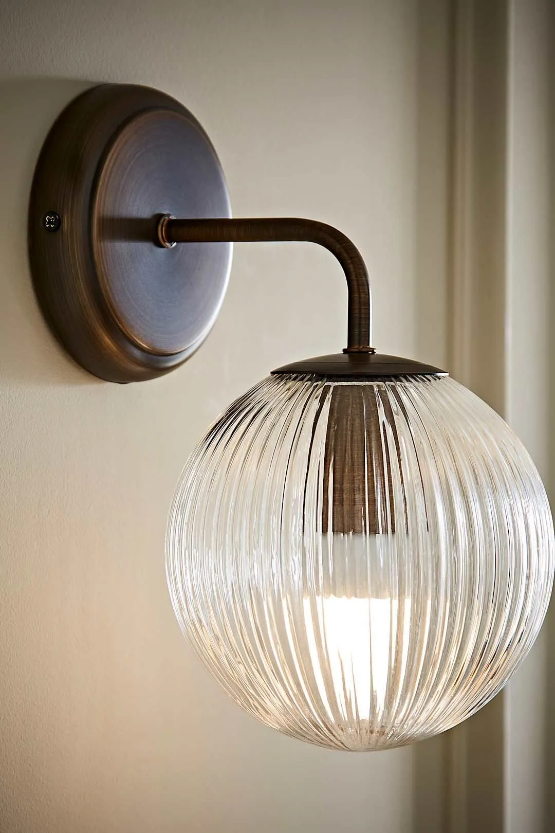 ValueLights Kempton Ribbed Glass Globe Shade Single Arm Wall Light in Bronze 1