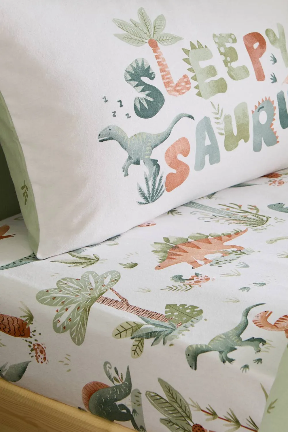 Catherine Lansfield 'Brushed Sleepy Saurus Dino' Cotton Fitted Sheet in Cream