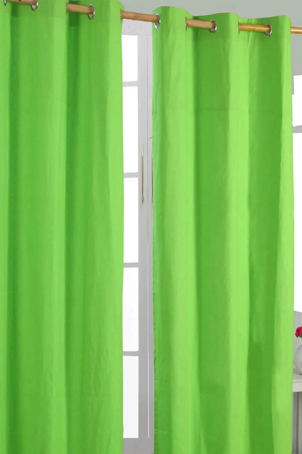 Homescapes Plain Cotton Ready Made Eyelet Curtain Pair in Green 1