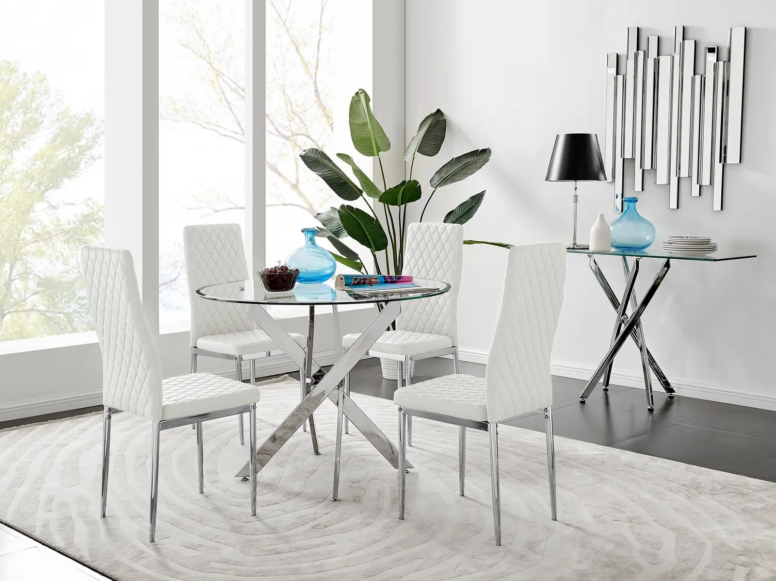 FurnitureboxUK Novara Clear Tempered Glass 100cm Round Dining Table with Chrome Starburst Legs & 4 Milan Faux Leather Chairs in White