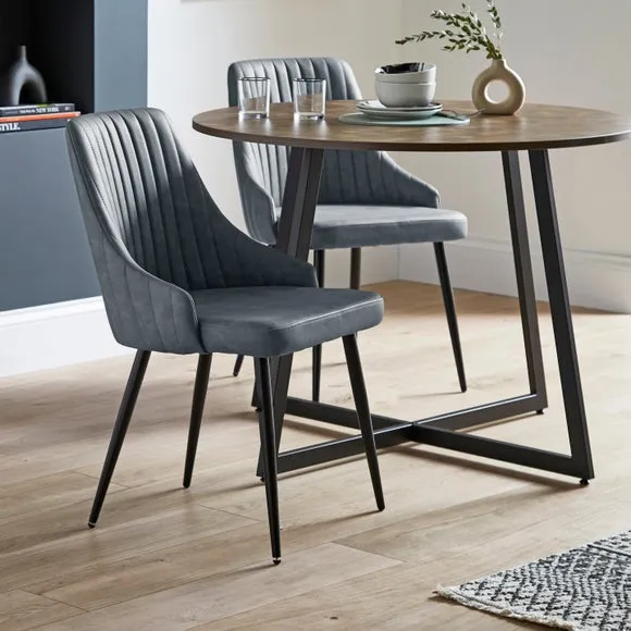 Brayden 4 Seater Round Dining Table with 4 Shea Navy Faux Leather Dining Chairs 2