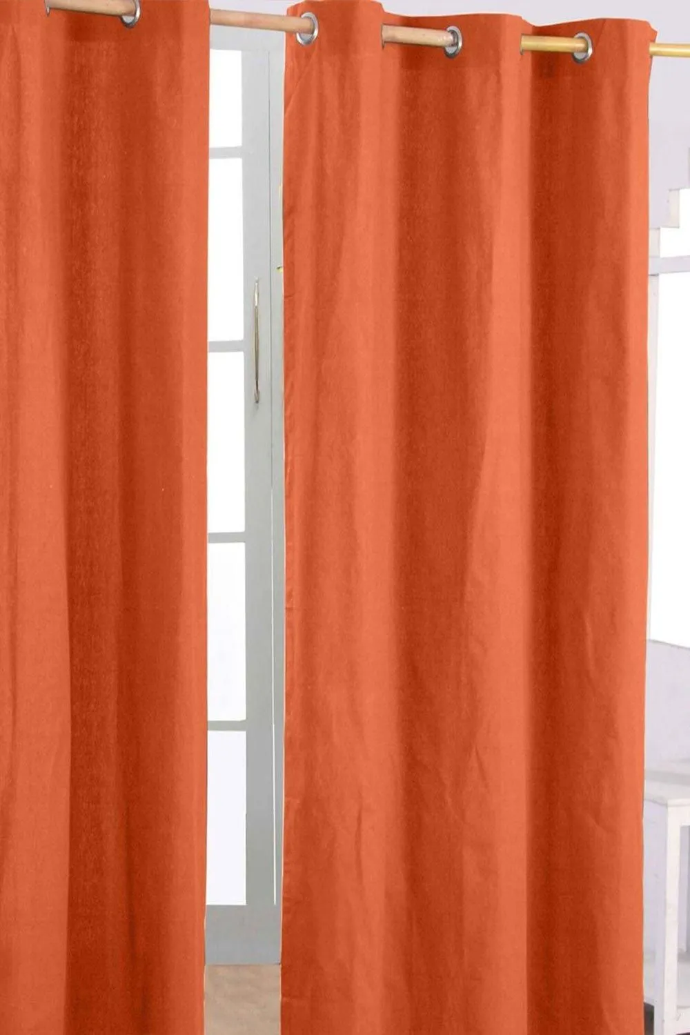 Homescapes Plain Cotton Ready Made Eyelet Curtain Pair in Burnt Orange 1